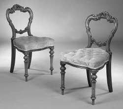 A set of six mid 19th century walnut dining chairs