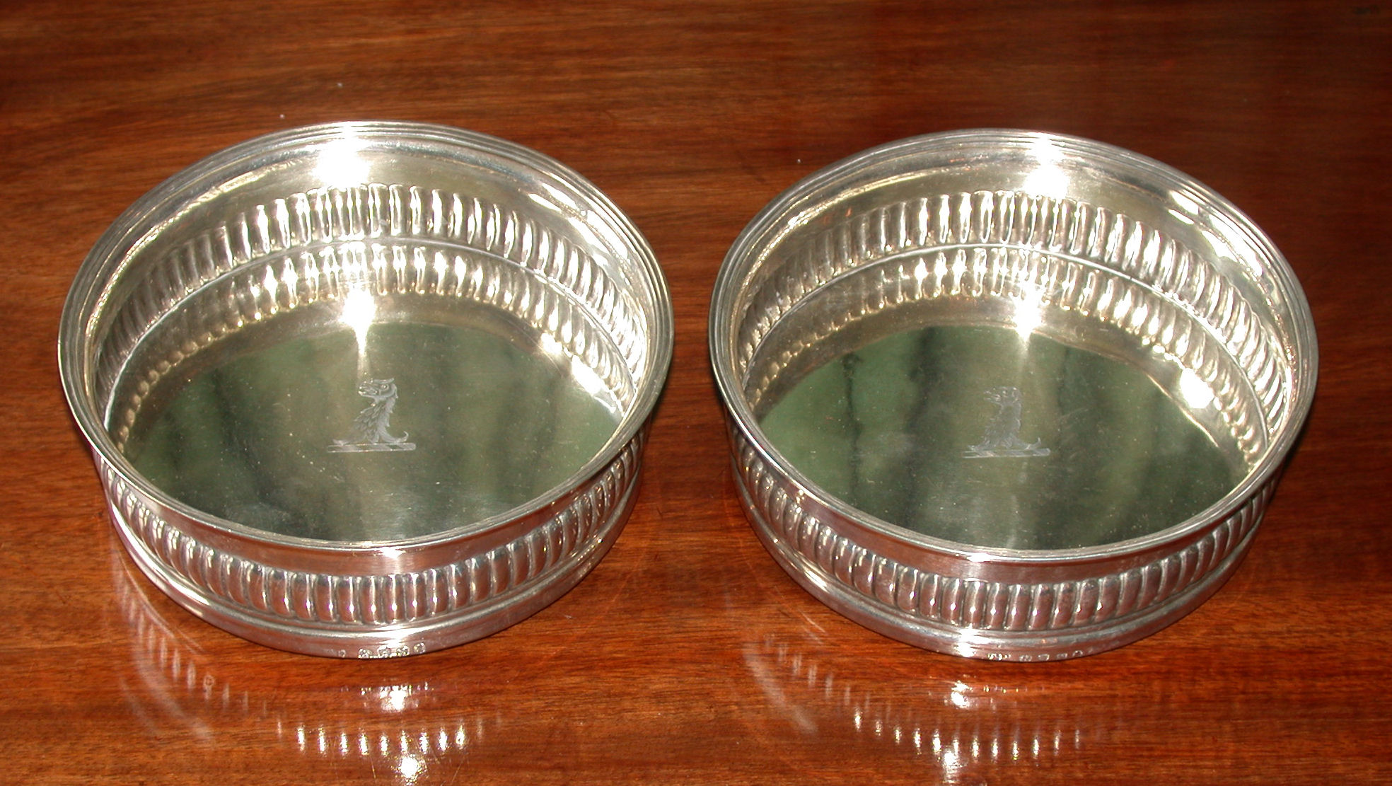 A pair of George III bottle coasters,