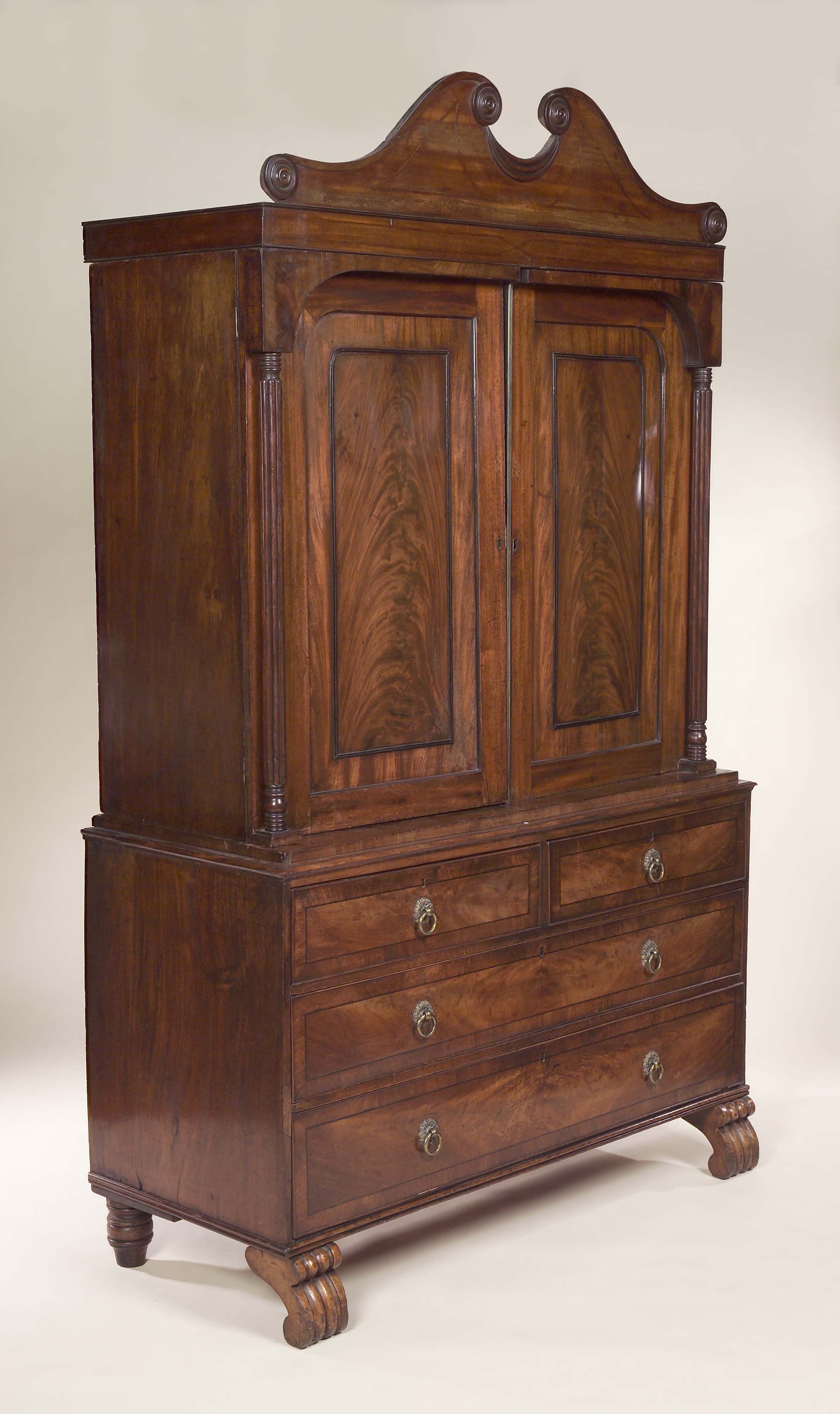An early 19th century mahogany linen press,