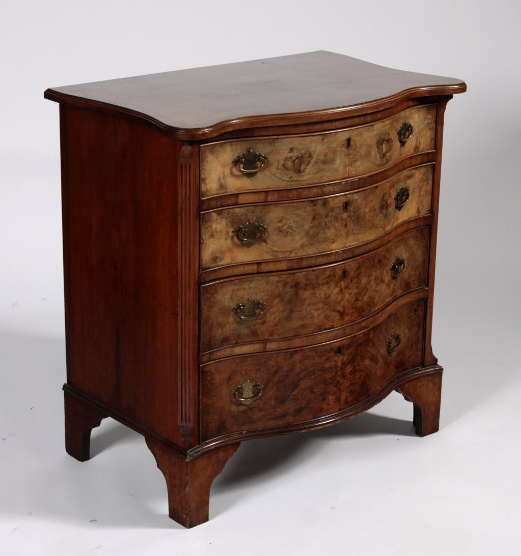 A George III style walnut serpentine batchelor's chest