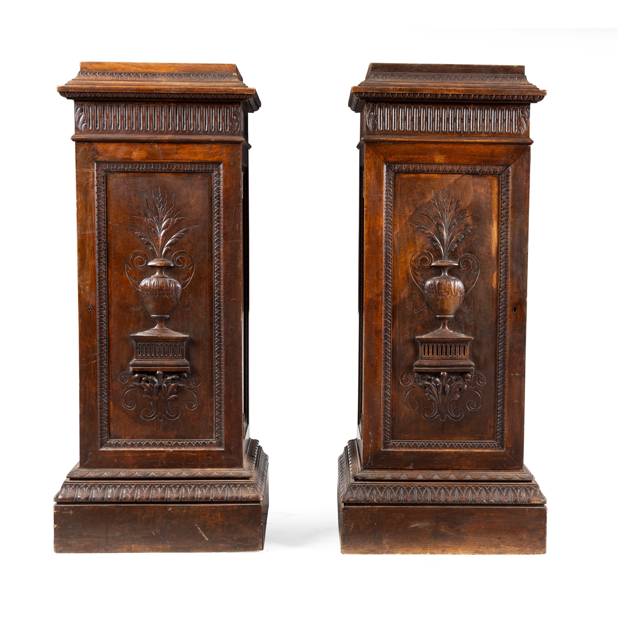 A PAIR OF WALNUT PEDESTAL CUPBOARDS