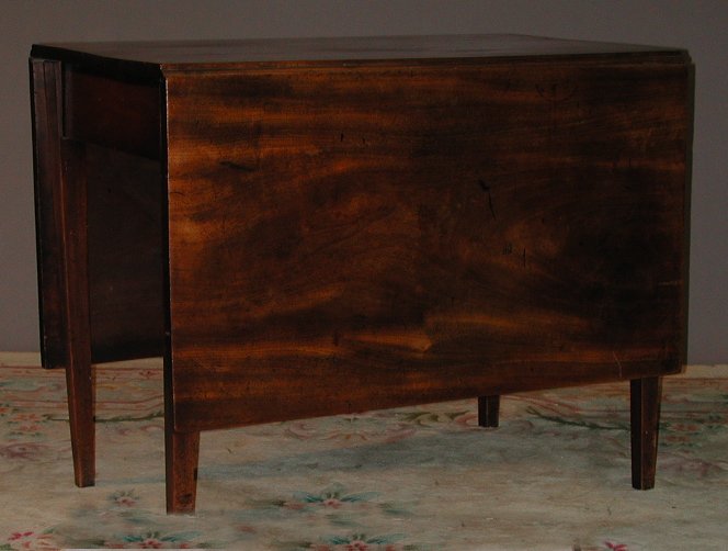 A 19th century rectangular drop leaf dining table
