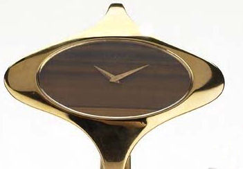 CHOPARD - a 1970's lady's 18ct gold bangle watch,