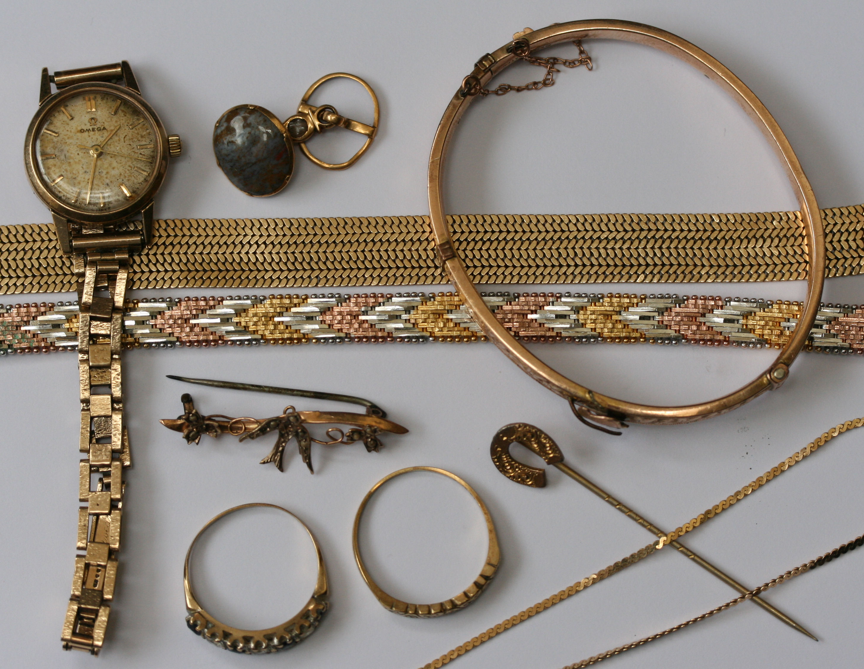A collection of gold and gilt jewellery