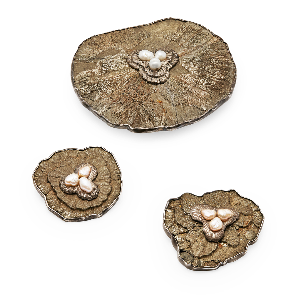 DESIGNED BY GRIMA - A pyrite and freshwater pearl buckle and two matching brooches