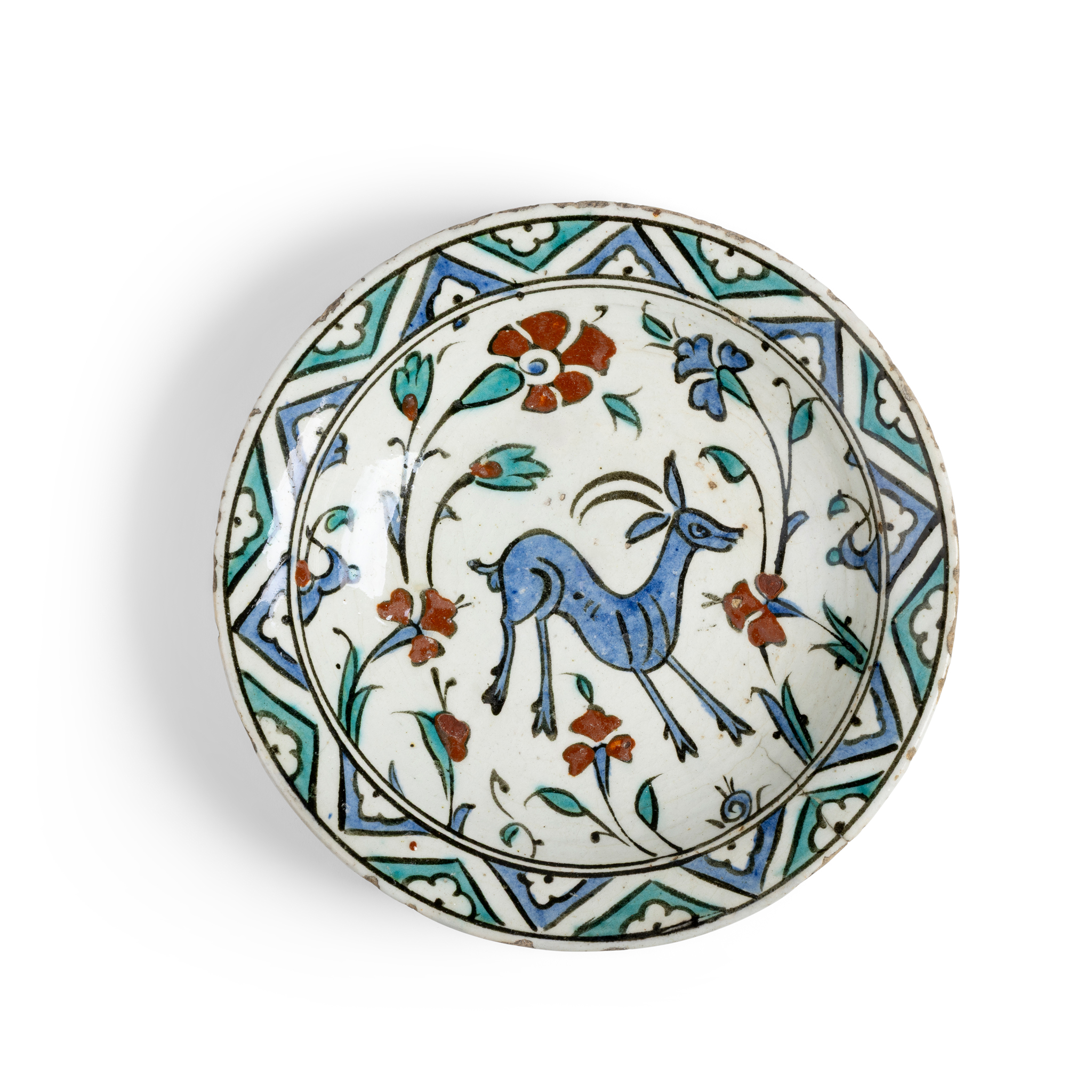 AN IZNIK POTTERY DISH DECORATED WITH A DEER