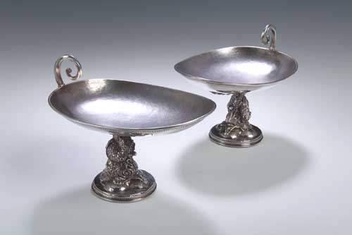 A pair of Arts and Crafts silver bon bon dishes,