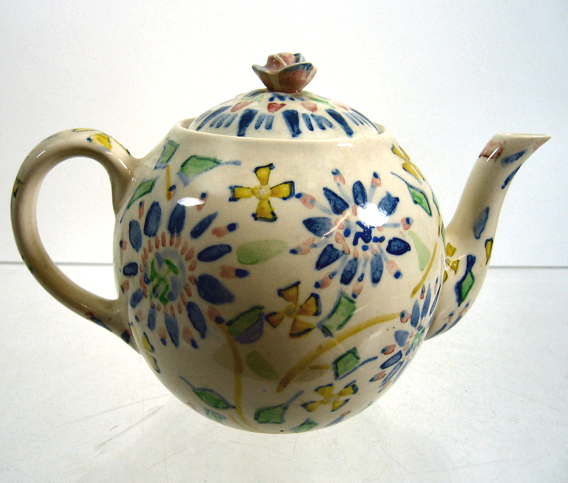 Jessie M. King (1875-1949) An earthenware teapot and cover,