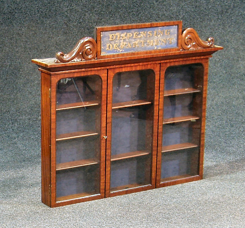 A late Victorian mahogany Pharmacist's hanging cabinet