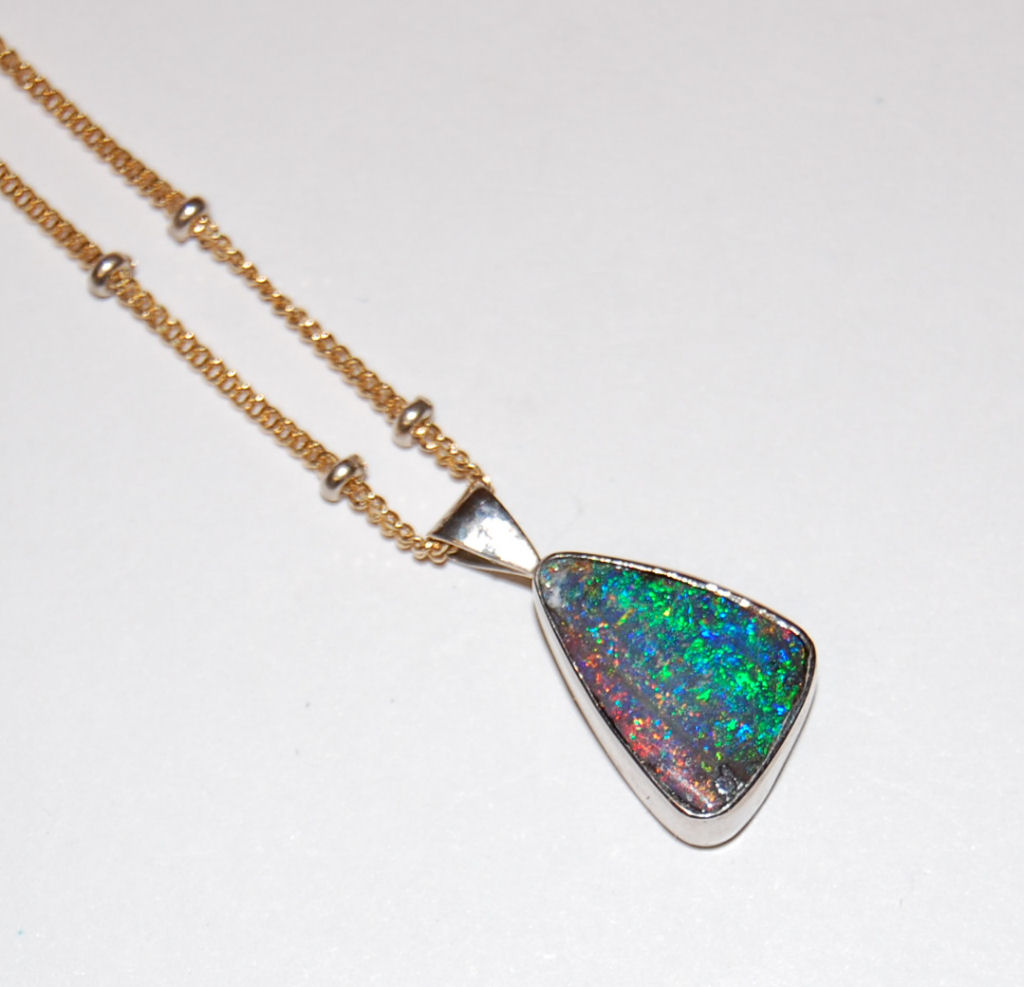An 18ct gold mounted boulder Opal pendant