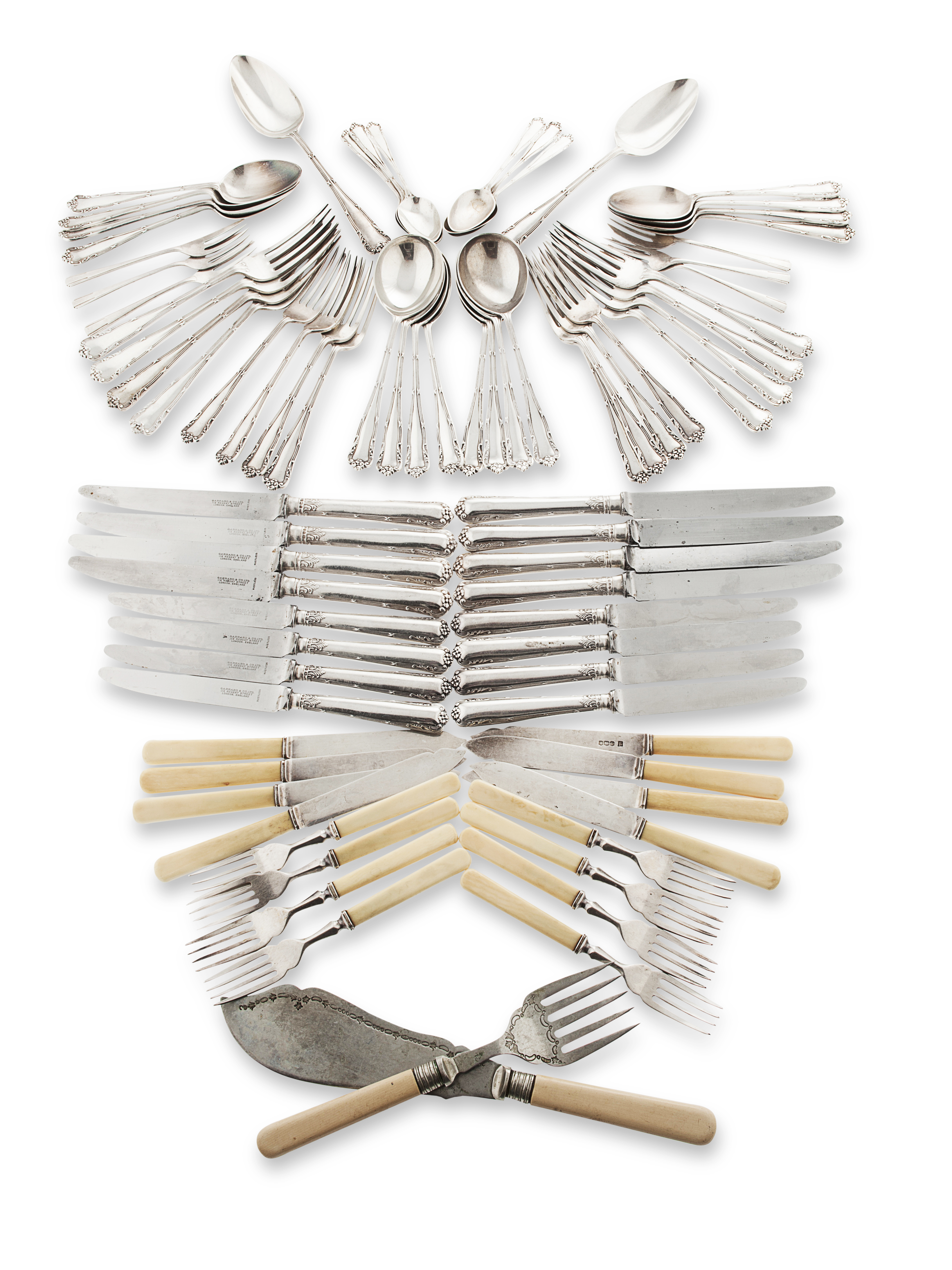 A suite of silver flatware and cutlery