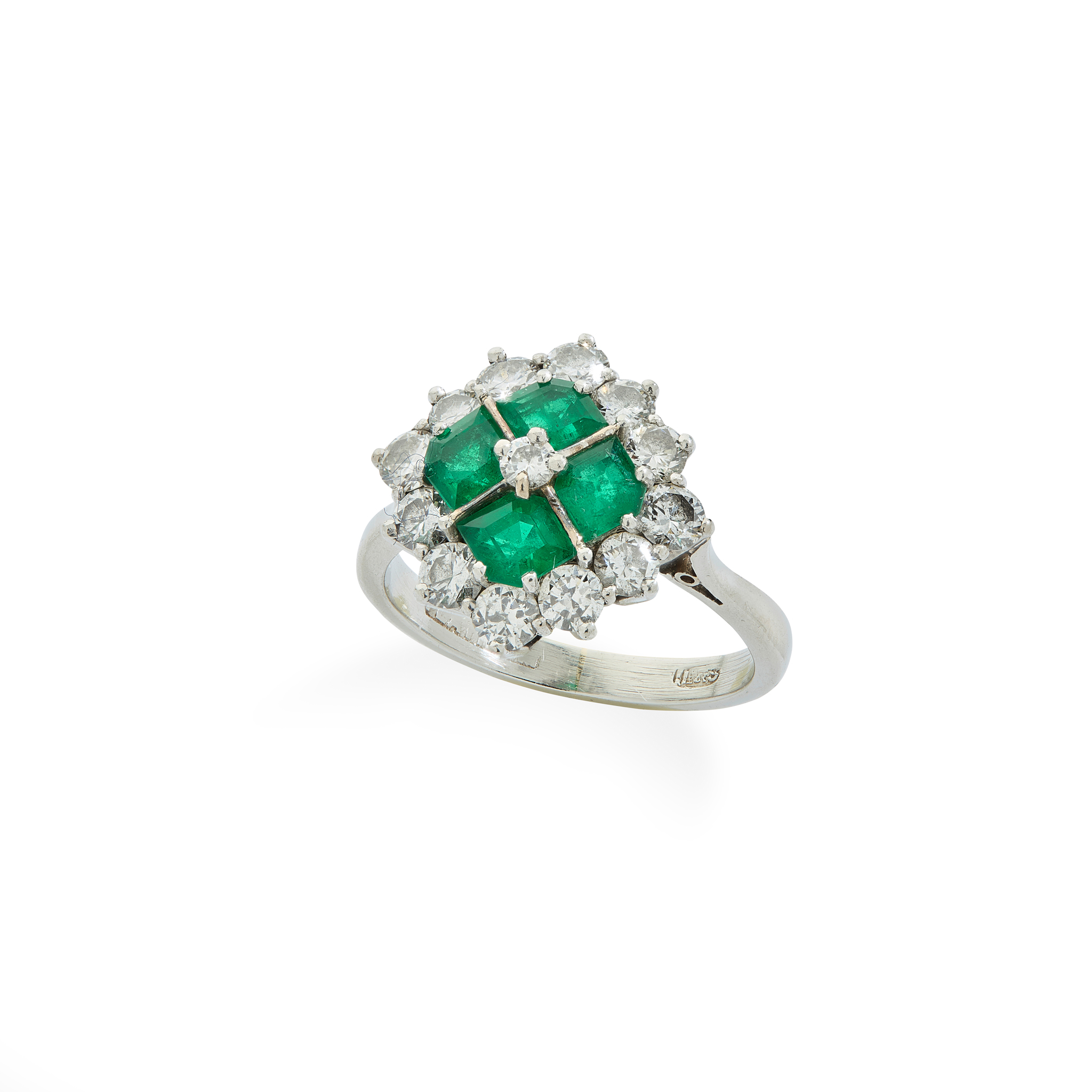 An emerald and diamond cluster ring