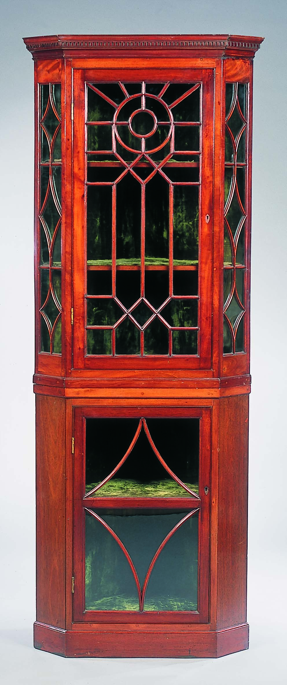 An Edwardian mahogany corner display cabinet