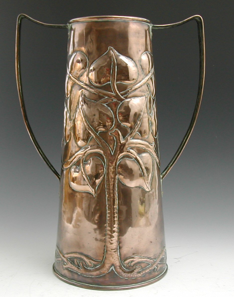 An Arts and Crafts copper twin handled vase,