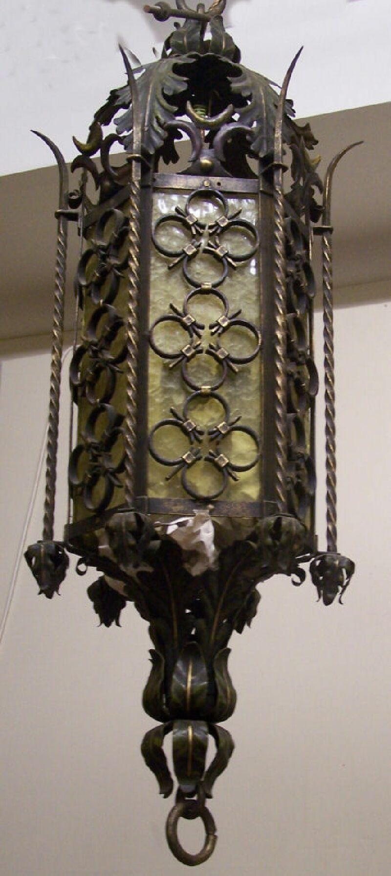 A wrought iron hall lantern