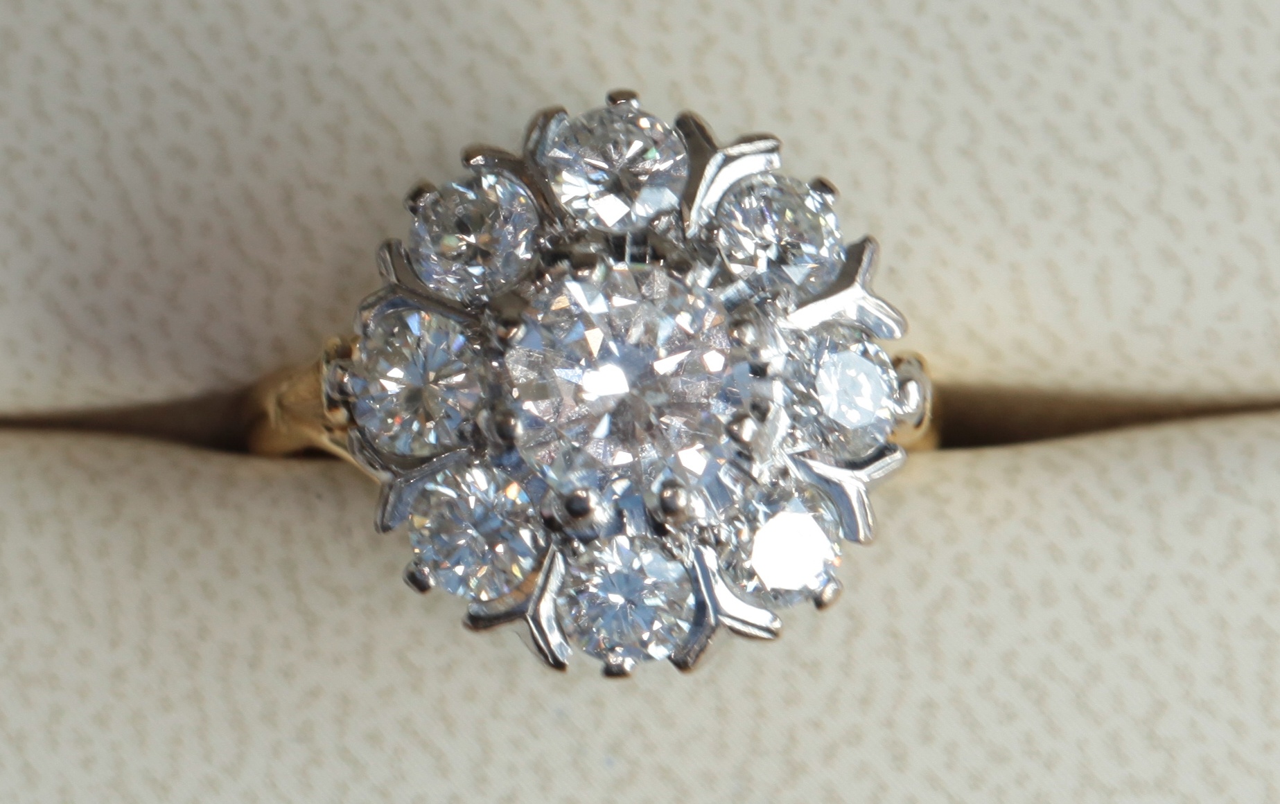 AMENDED DIAMOND WEIGHT An 18ct yellow gold mounted diamond set cluster ring