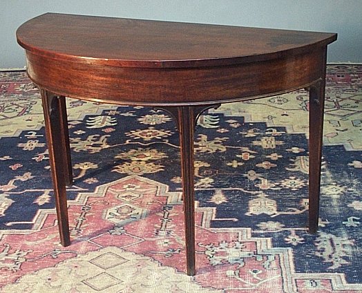 A mahogany demi-lune side table