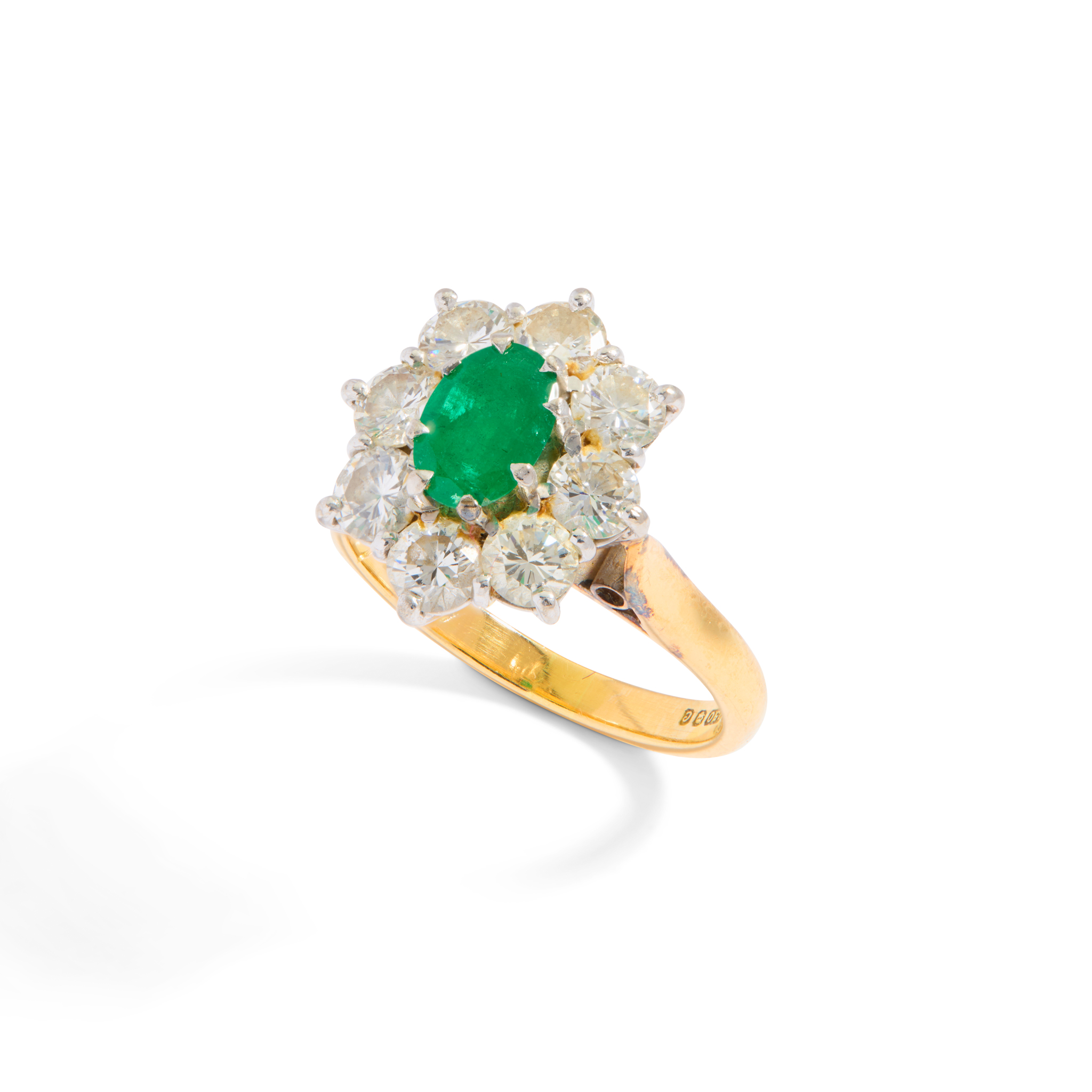 An 18ct gold emerald and diamond cluster ring