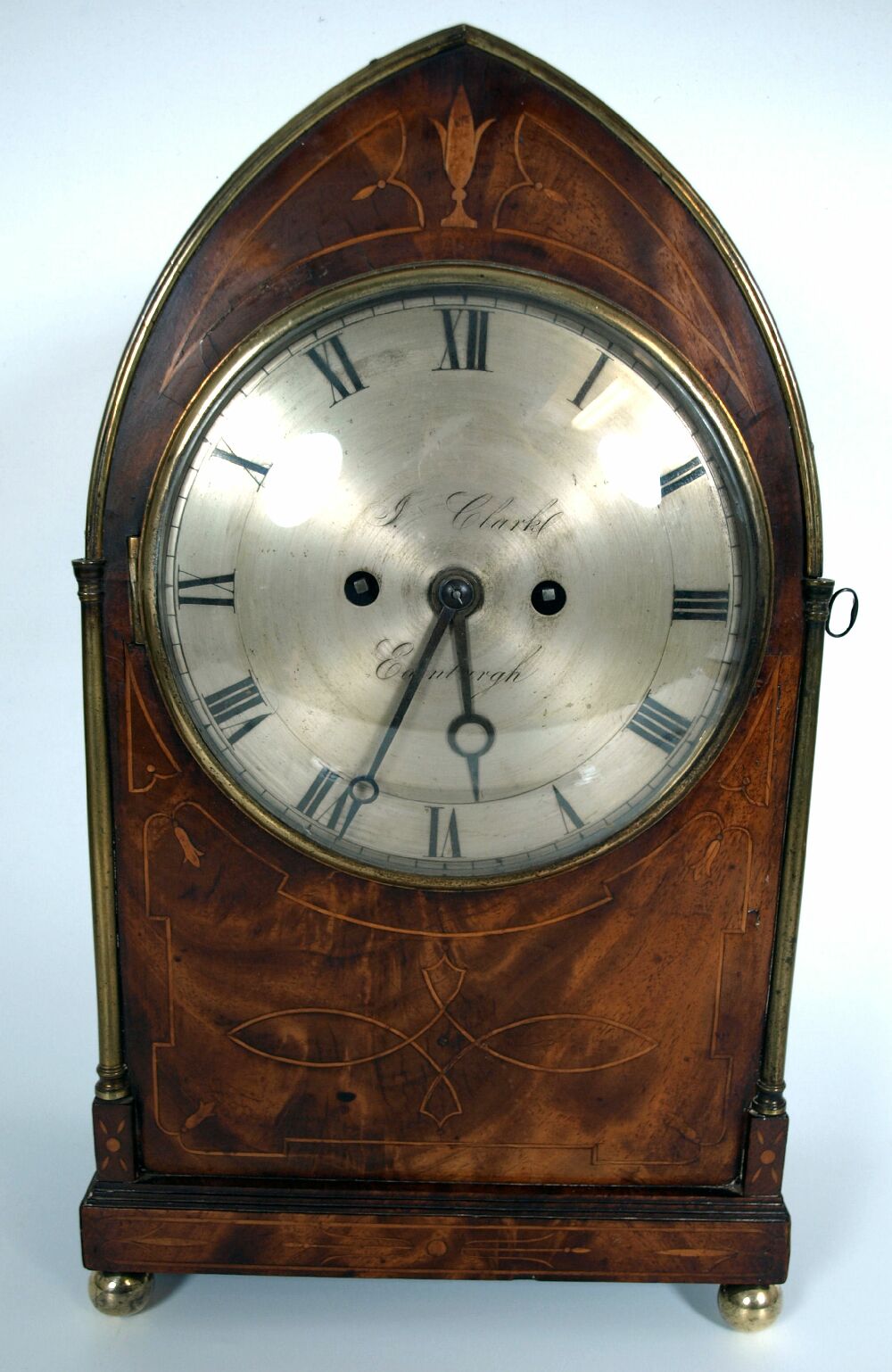 A Regency mahogany and brass Gothic style mantel clock By J.Clark, Edinburgh