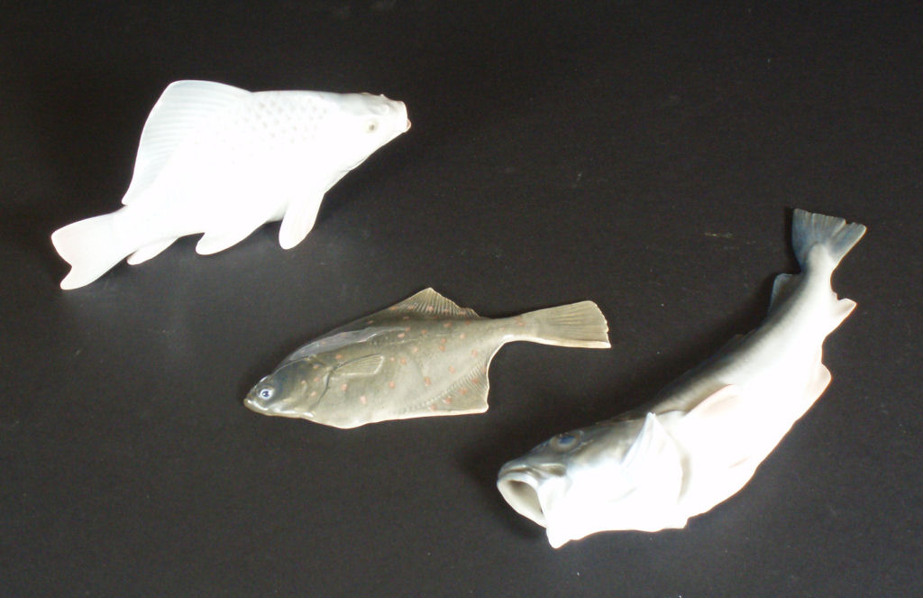 Three Royal Copenhagen porcelain figures of fish
