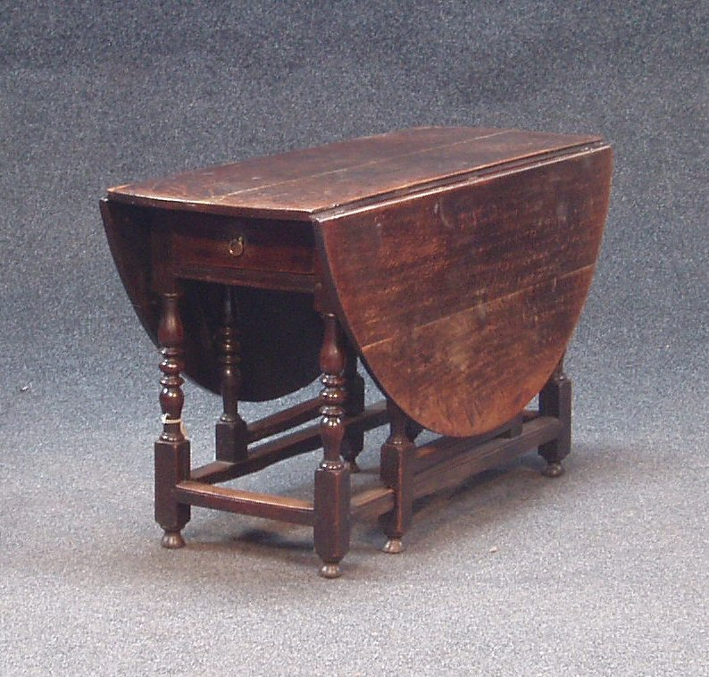 An 18th century oak gateleg table,