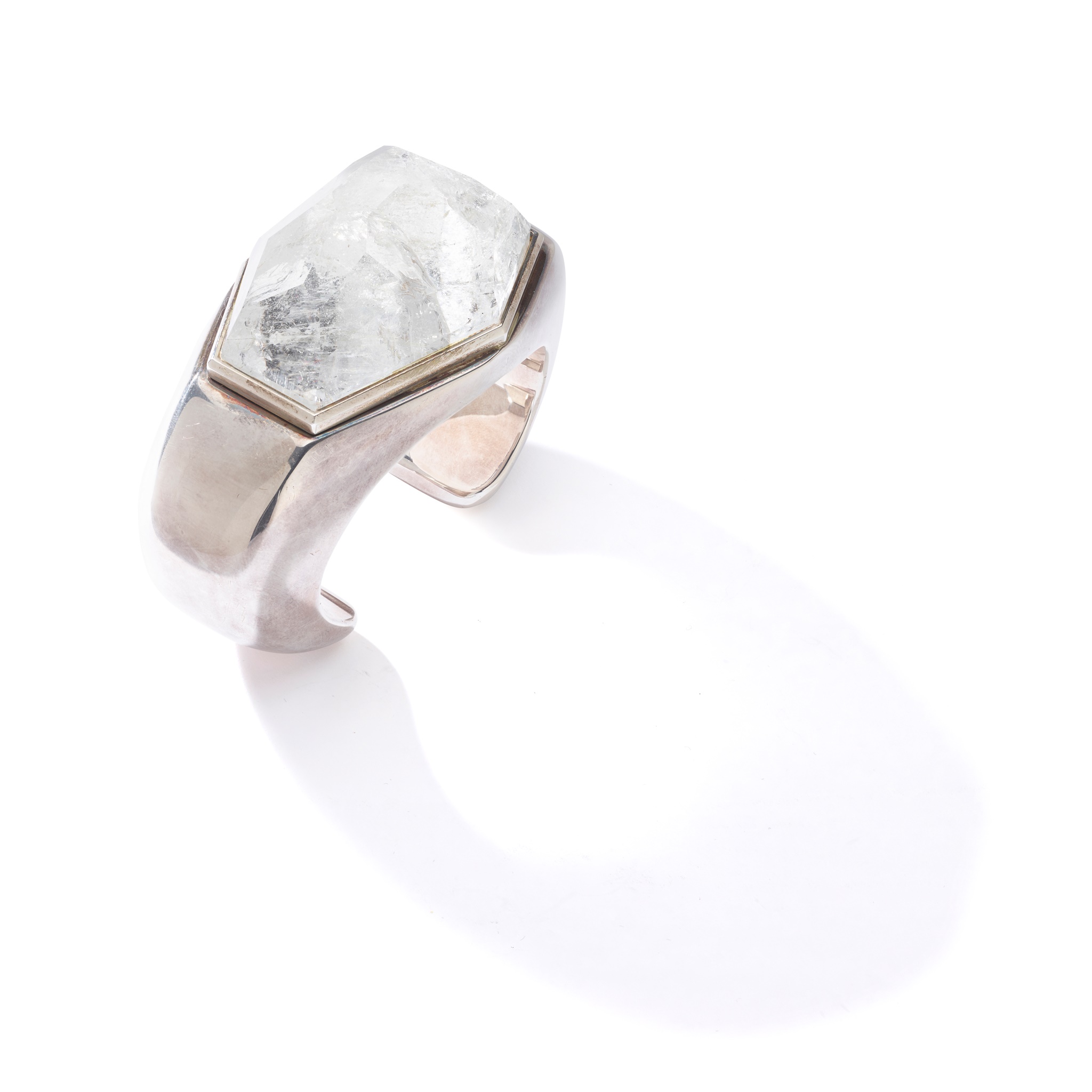 A rock crystal and silver bangle