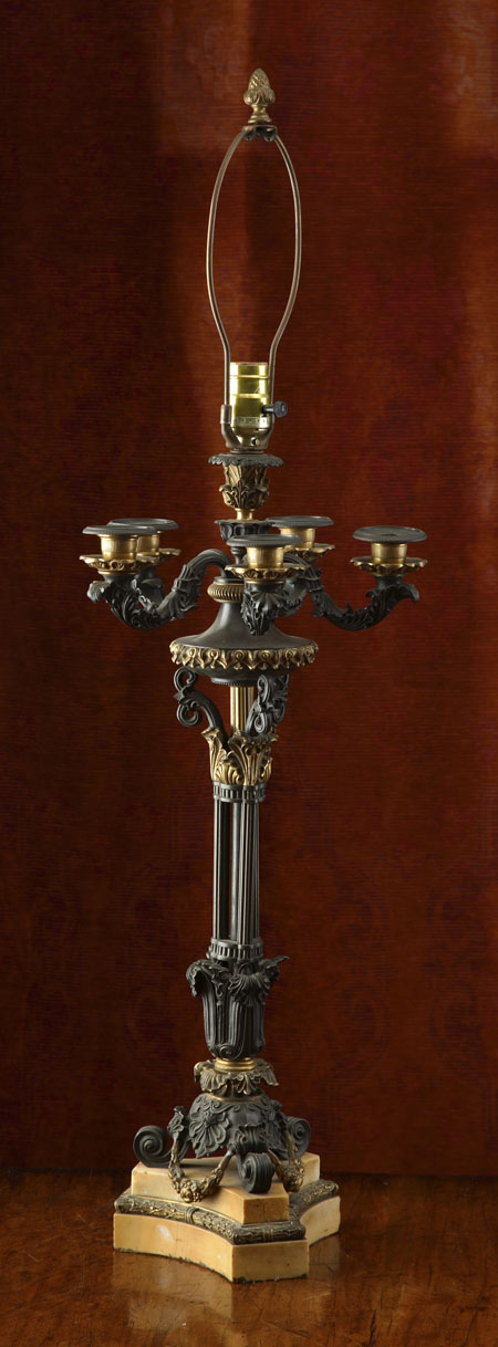 A French bronze and gilt metal candelabrum