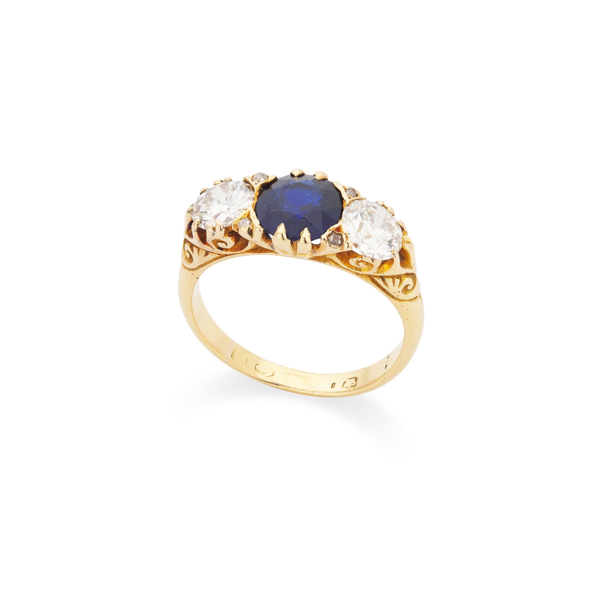 A sapphire and diamond three-stone ring