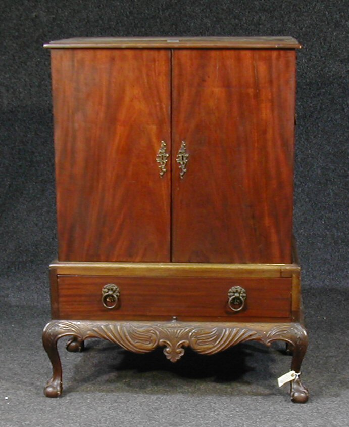 An 18th Century and later mahogany cabinet on stand,