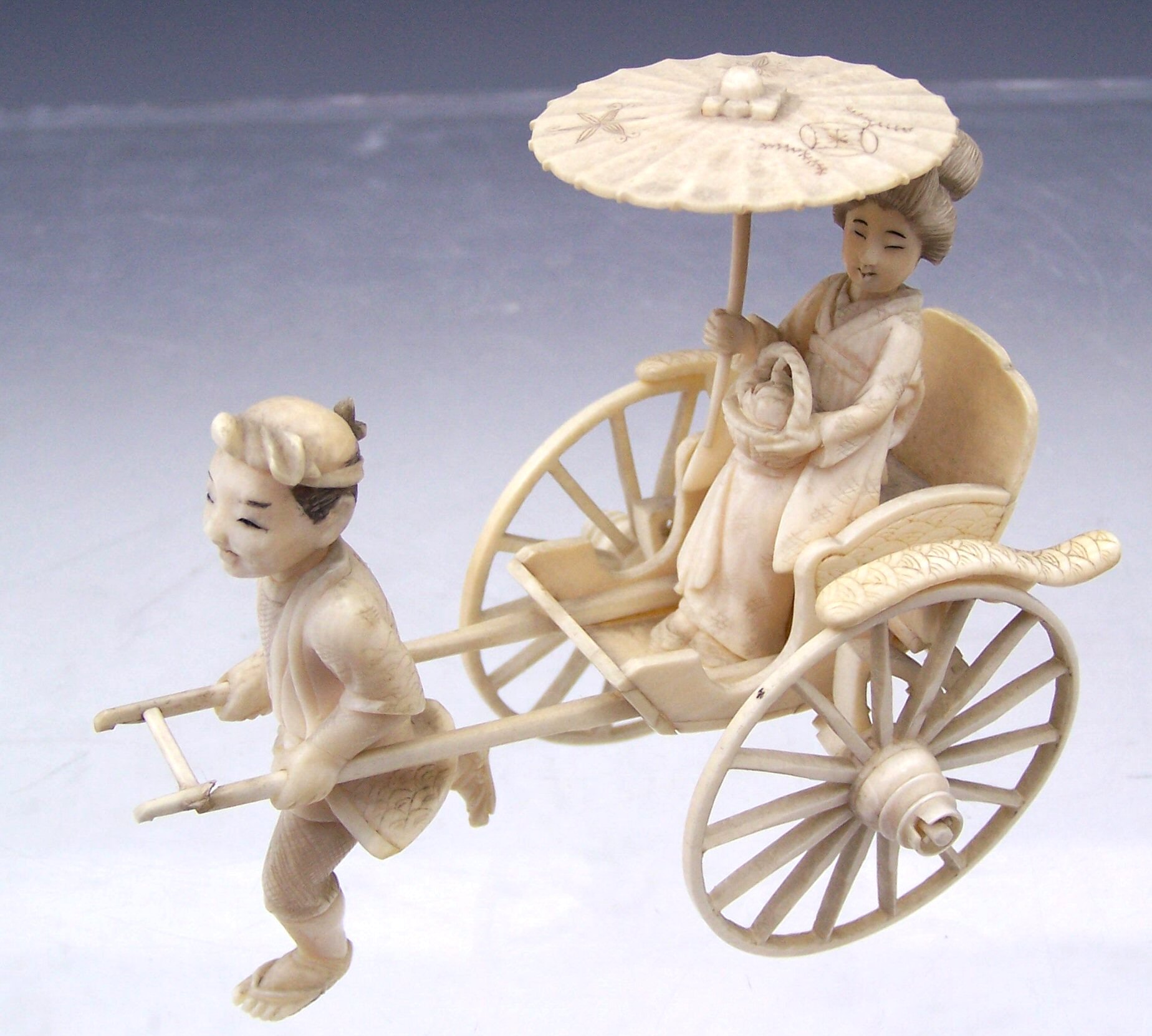 A Japanese ivory figure group, Meiji period,