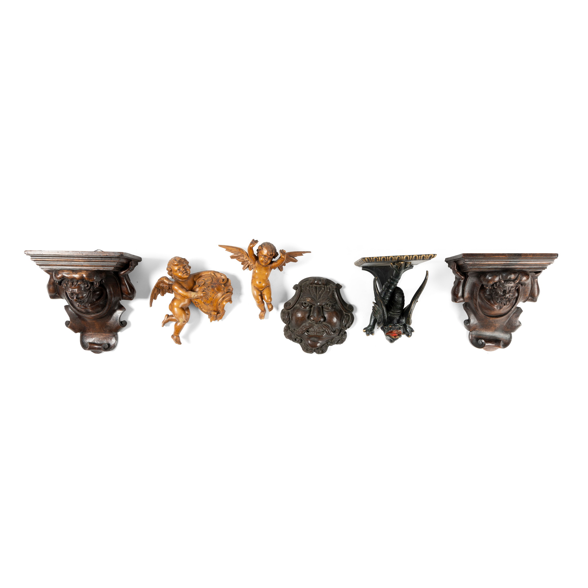 A GROUP OF FOUR WALL BRACKETS AND APPLIQUES