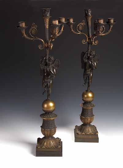 A pair of Empire style four light candelabra in bronze and gilt bronze,