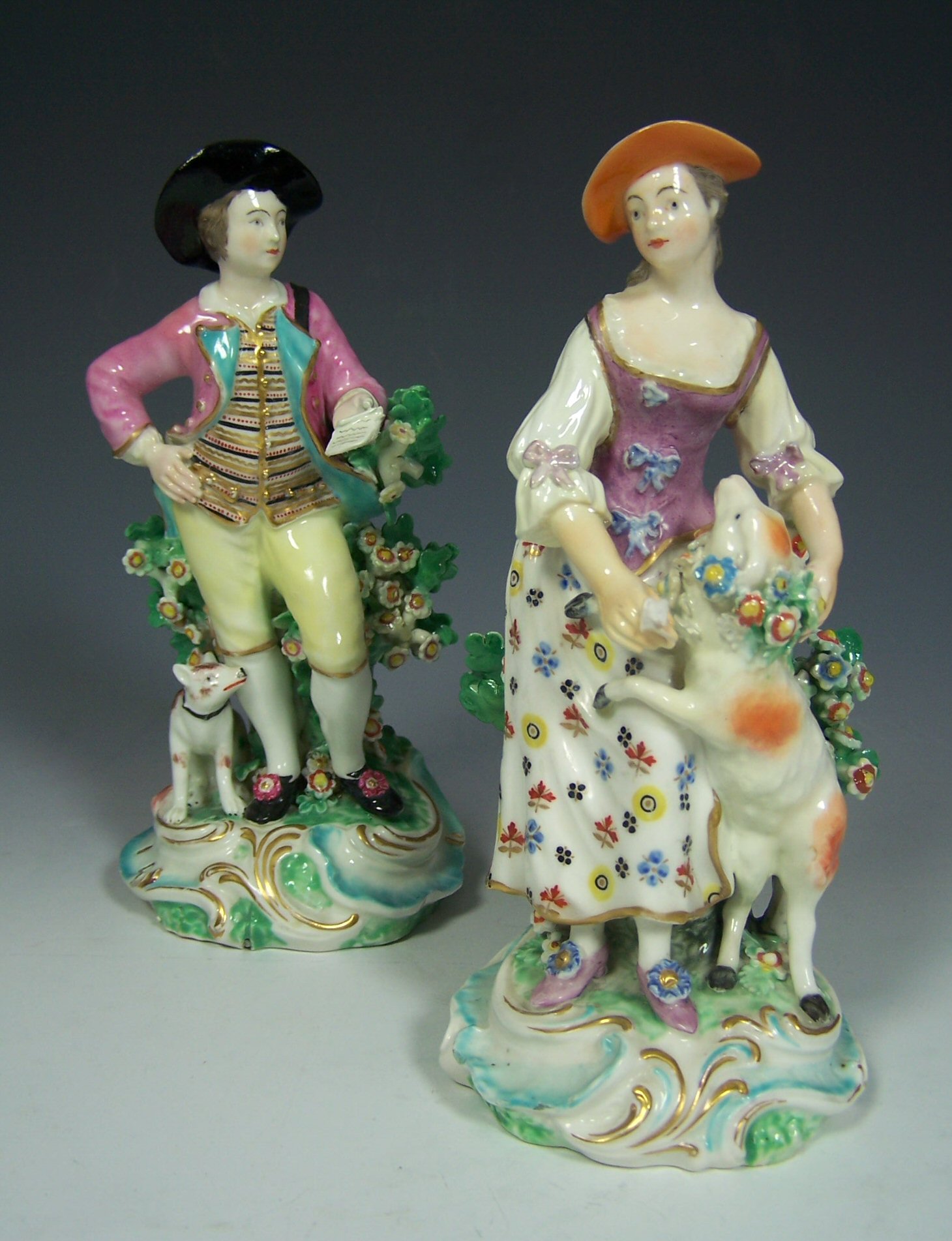 An 18th century Derby matched pair of a gallant and his lady dressed as a shepherdess