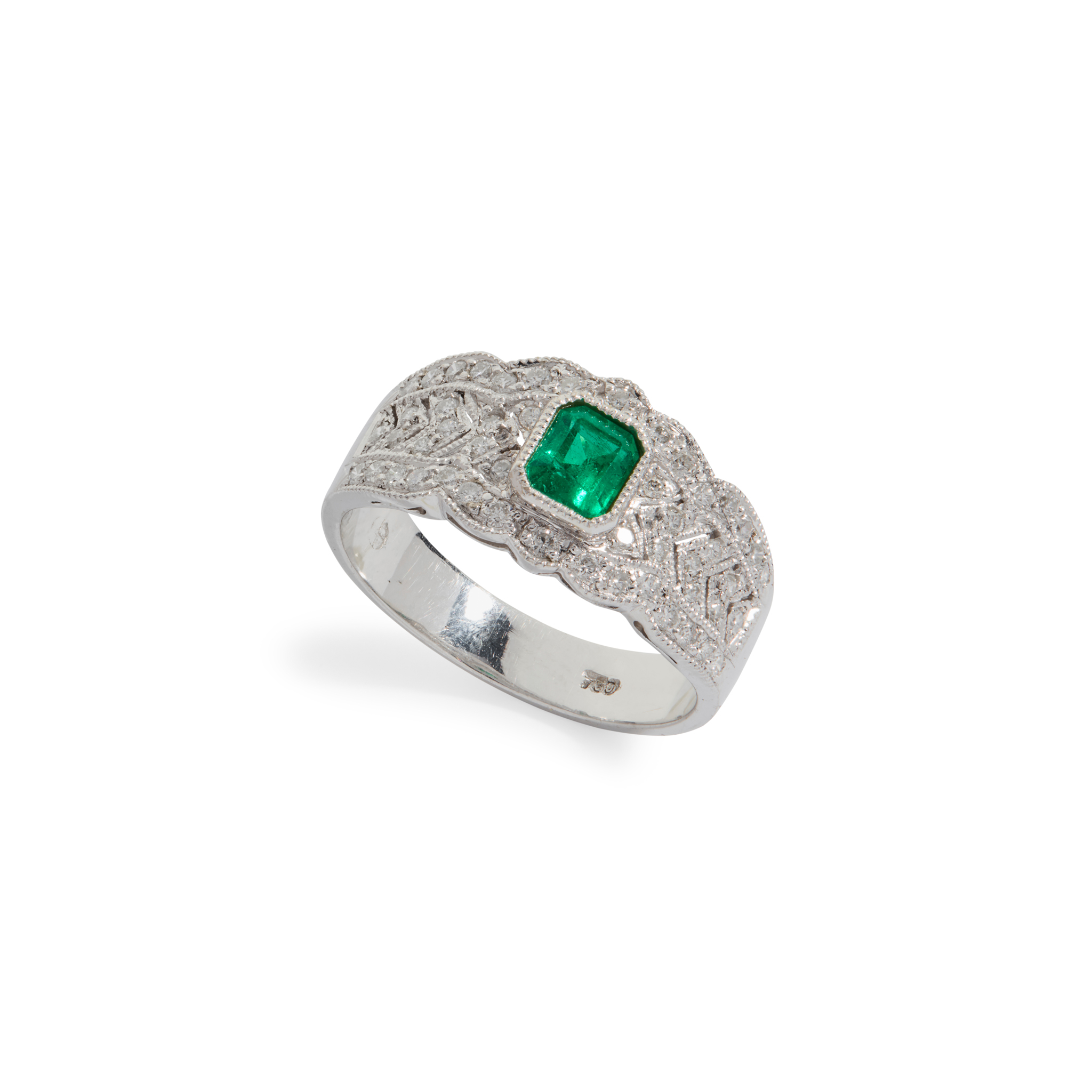 An emerald and diamond cluster ring
