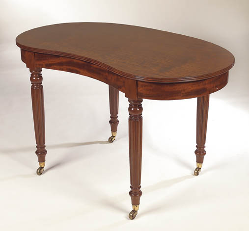 An early 19th century mahogany kidney shaped dressing table,