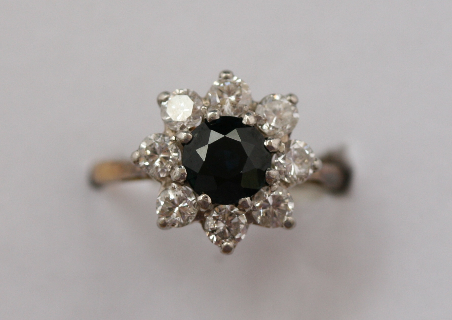 A sapphire and diamond cluster ring
