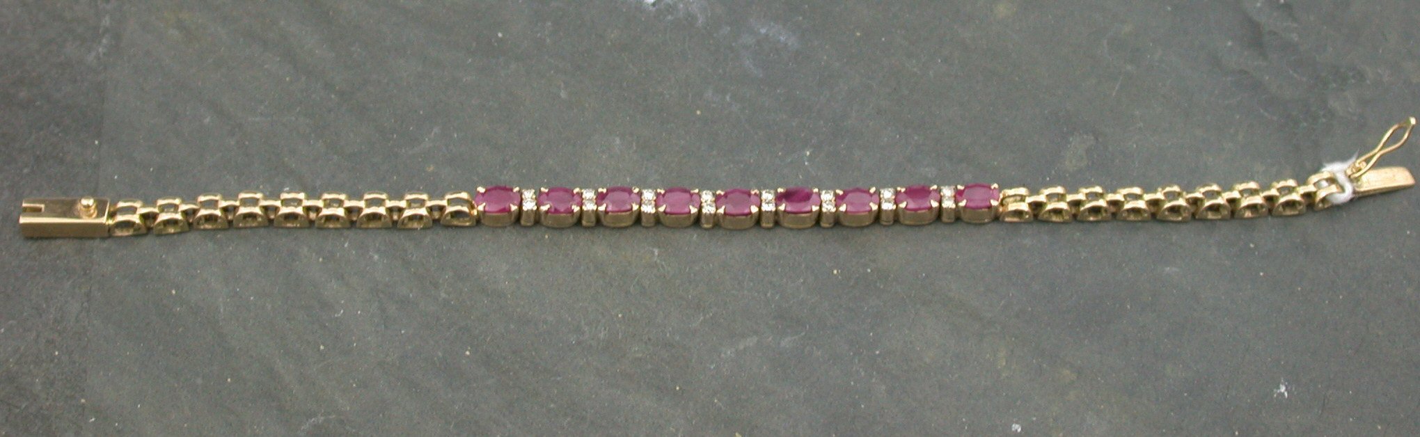 A continental gold ruby and diamond bracelet,