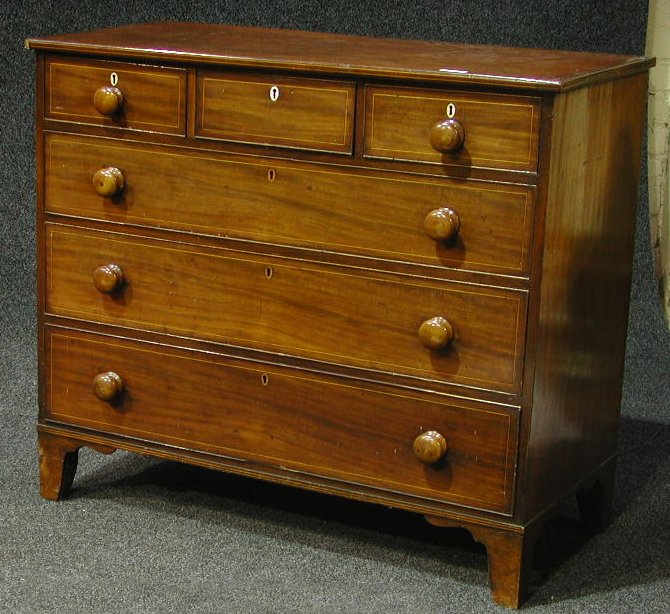 A George III mahogany boxwood strung chest of drawers,