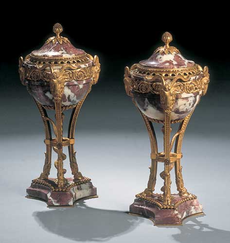 A pair of late 19th century pink marble and gilt brass mounted cassolettes