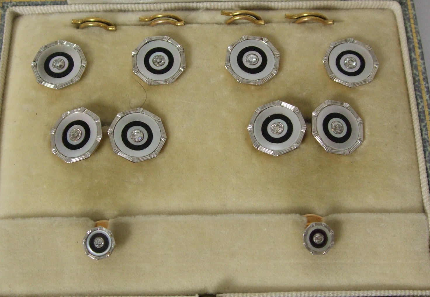 A cased set of Art Deco onyx, mother of pearl and diamond cufflinks and studs