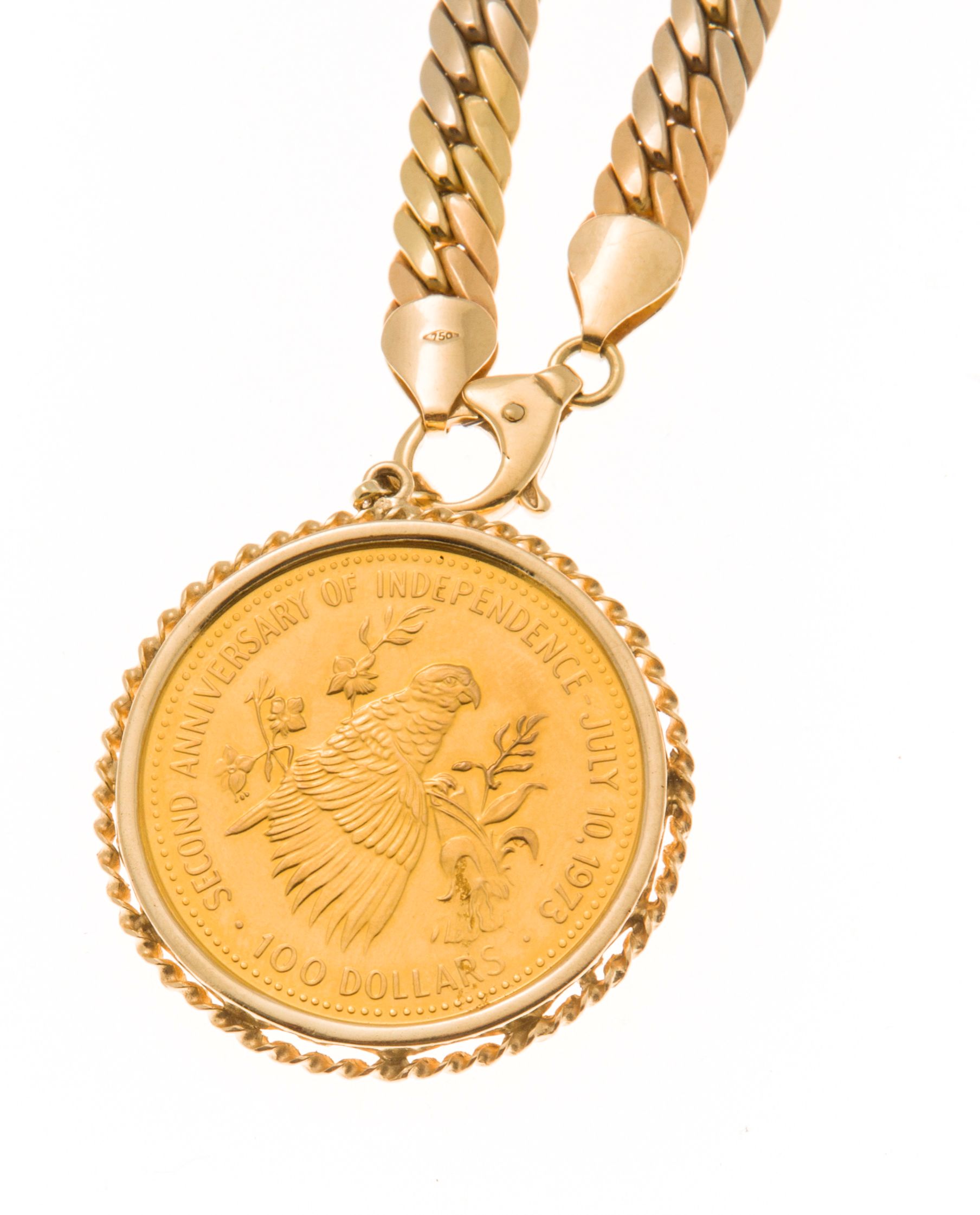 A Bahamas $100 dollar coin pendant and chain