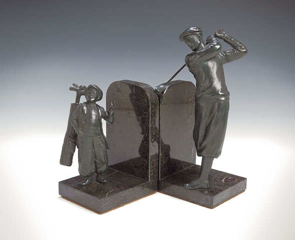 A pair of green patinated bronze bookends,