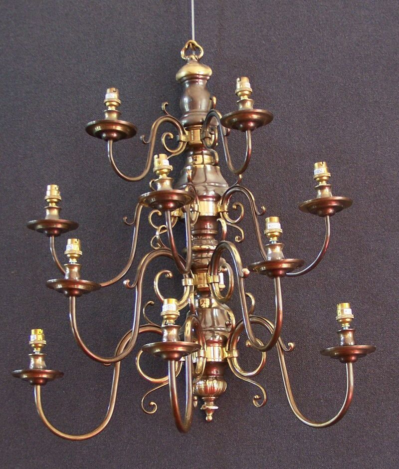 A pair of ten light brass wall sconces in the Dutch 18th century style