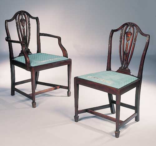 A set of eight early 20th century mahogany Hepplewhite style dining chairs