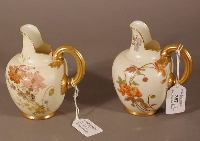 A pair of Royal Worcester jugs
