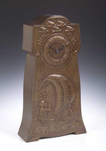 A Scottish Arts and Crafts copper mantel timepiece by Marion Henderson Wilson,