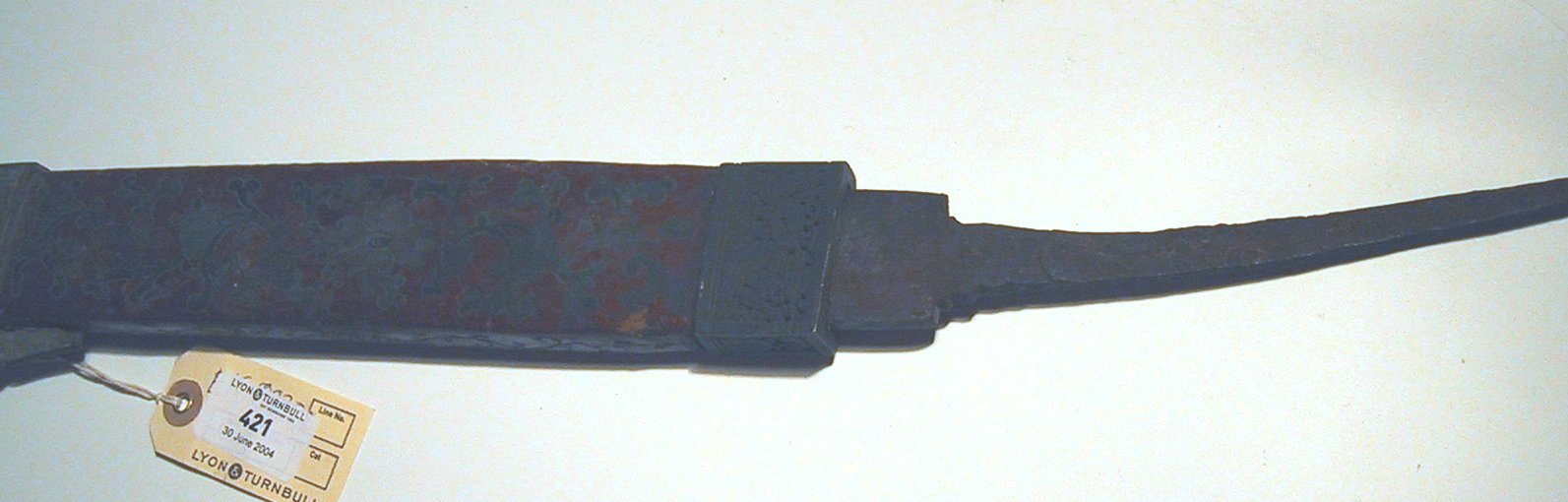 A Japanese sword with white ray-skin grip,