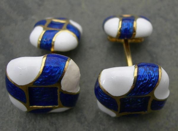 DAVID WEBB - a pair of blue and white enamel decorated cufflinks,