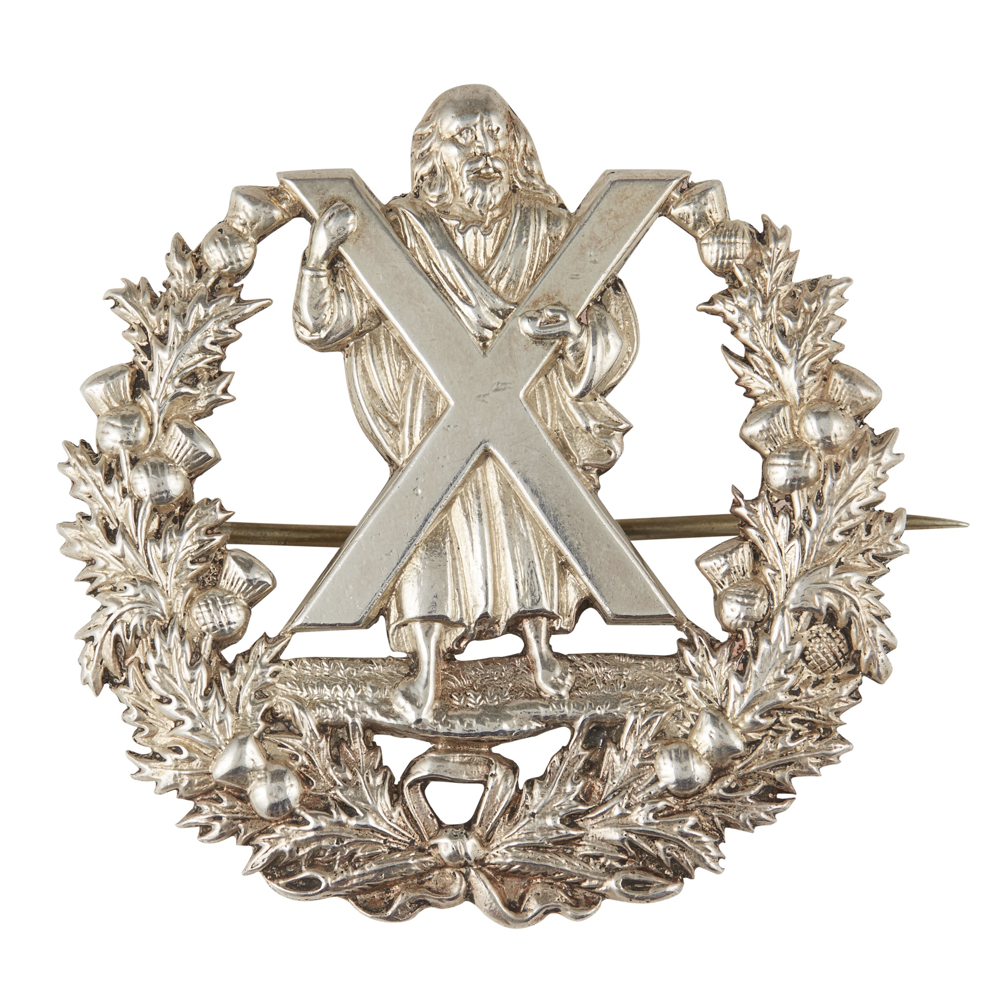 Two officer's cap badges