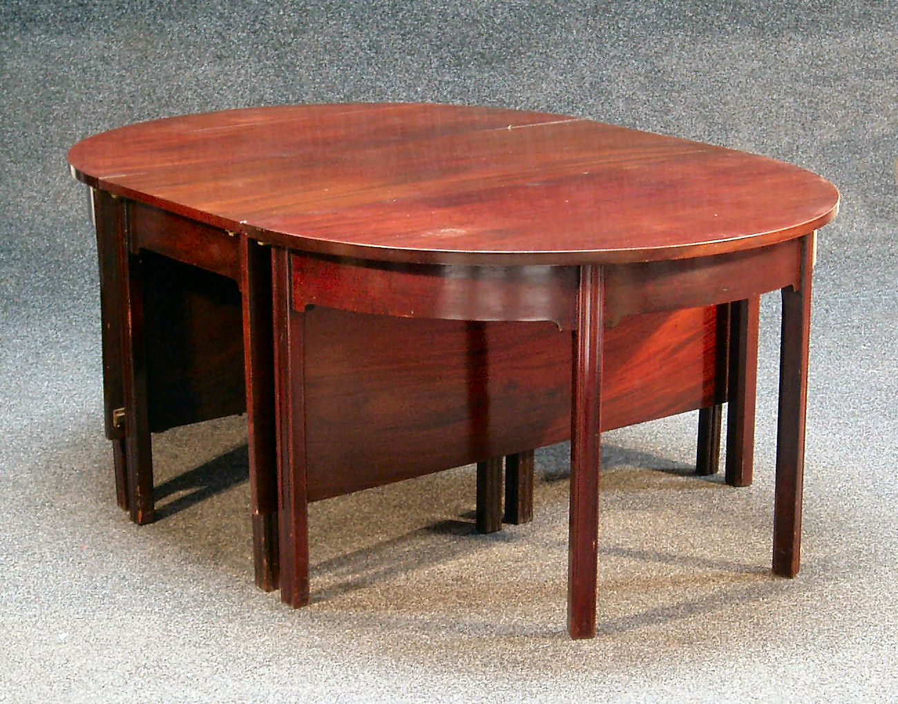 A George III mahogany D end dining table,